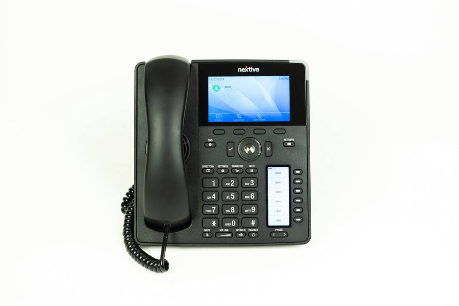 Close-up of business phone interface with call metrics